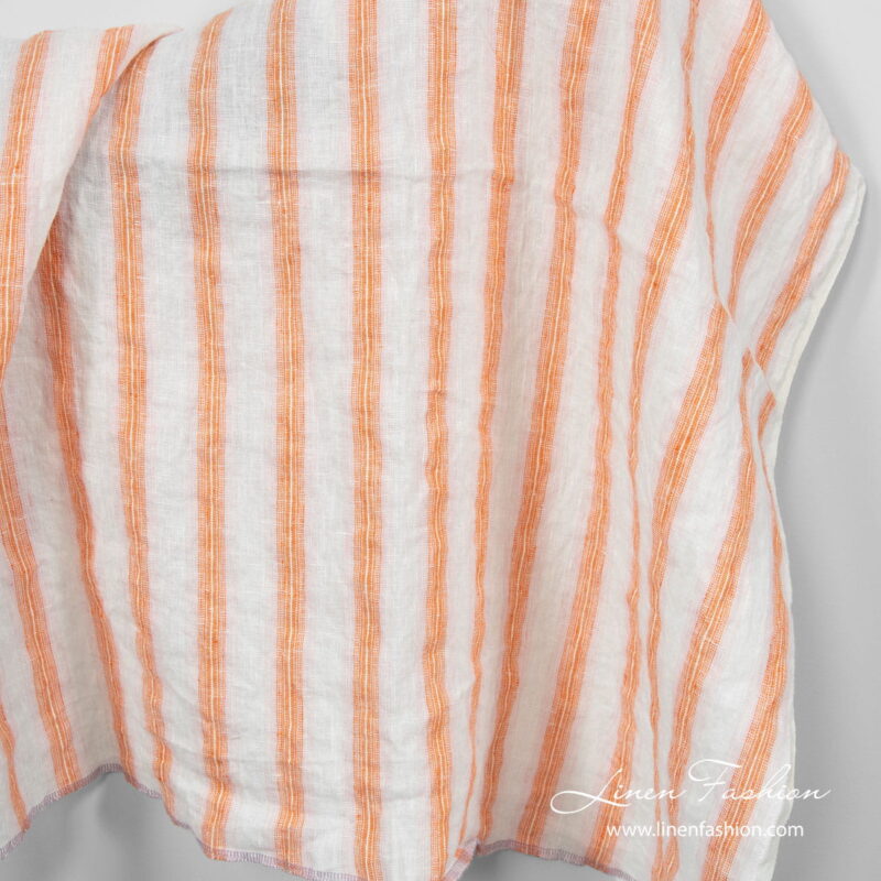 Washed linen fabric in orange stripes