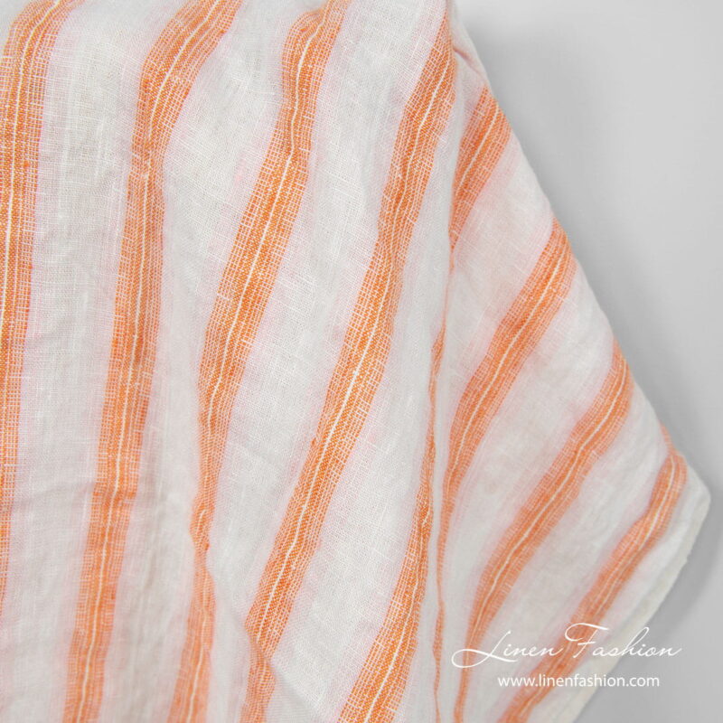 Linen fabric in off white, orange and light pink stripes, washed