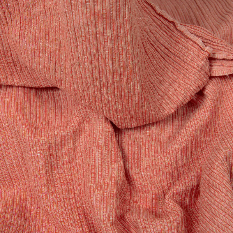 Washed linen cotton fabric in red-white stripes detail view