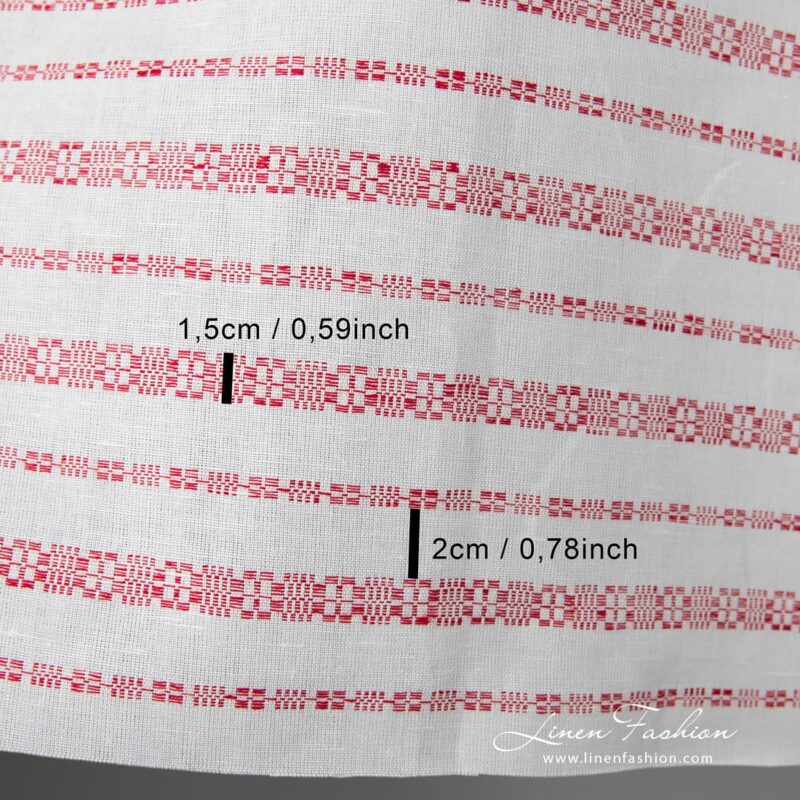 White linen-cotton fabric with horizontal red patterned stripes, woven in traditional folk geometric ornaments