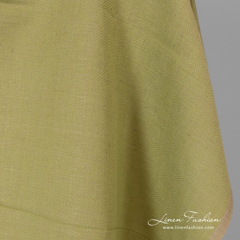 Diamond patterned green grey fabric.
