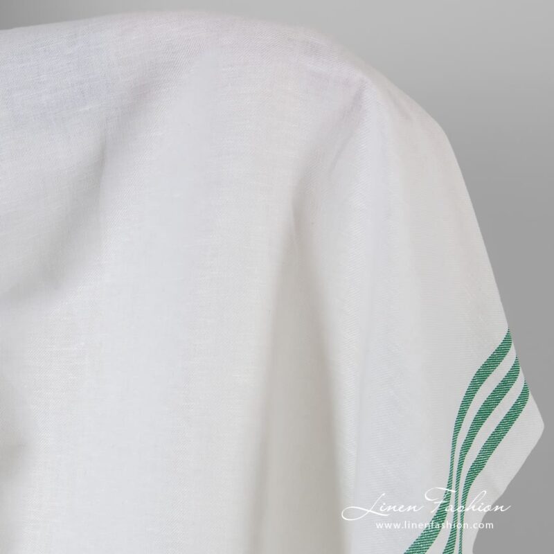 Optical white linen cotton fabric in green stripes