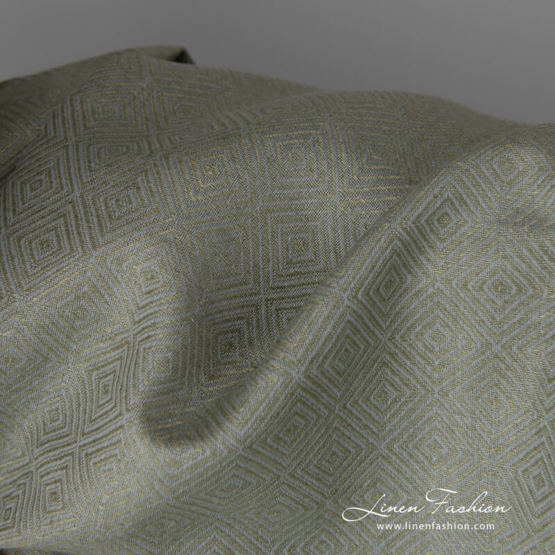 Linen cotton fabric in greyish green diamond pattern close up detail