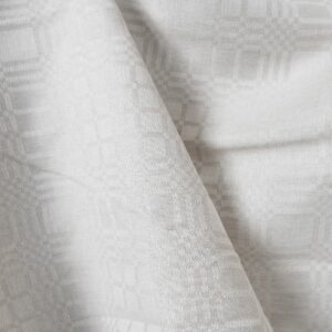 Linen cotton fabric in light beige checks detail view