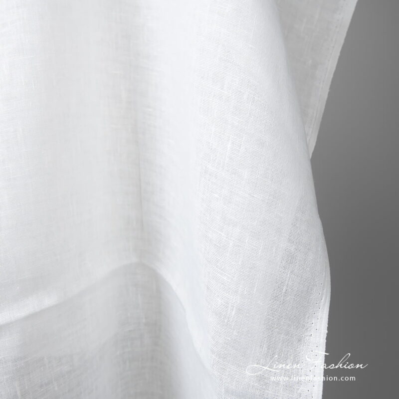 Lightweight linen fabric bright white colour edge view