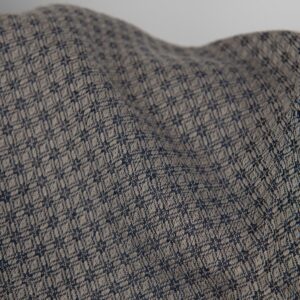 Linen cotton fabric blue and beige diamond pattern close up detail