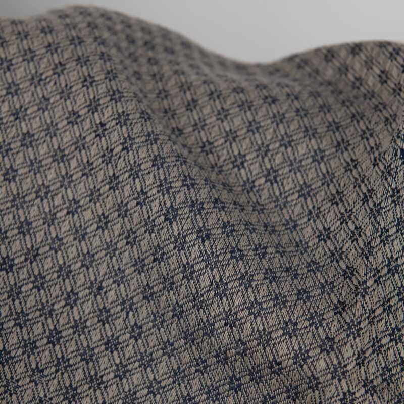 Linen cotton fabric blue and beige diamond pattern close up detail