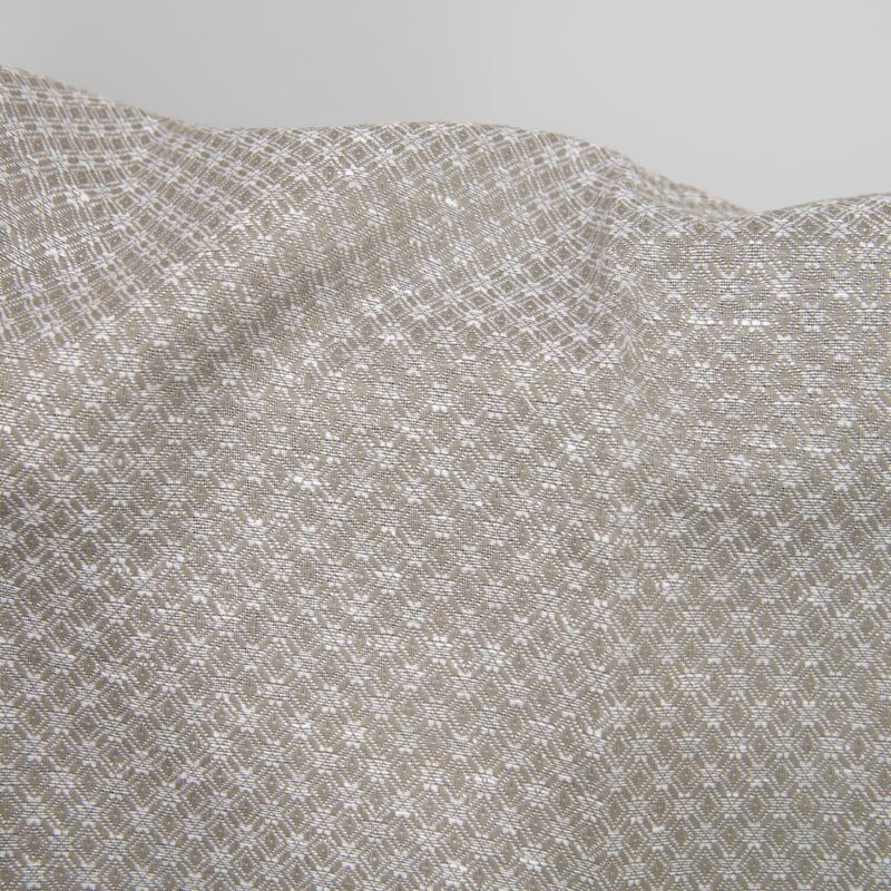 Linen cotton fabric dark beige and white diamonds close up detail