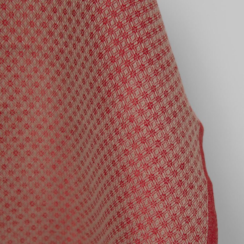 Linen cotton fabric red and beige diamond pattern close up detail