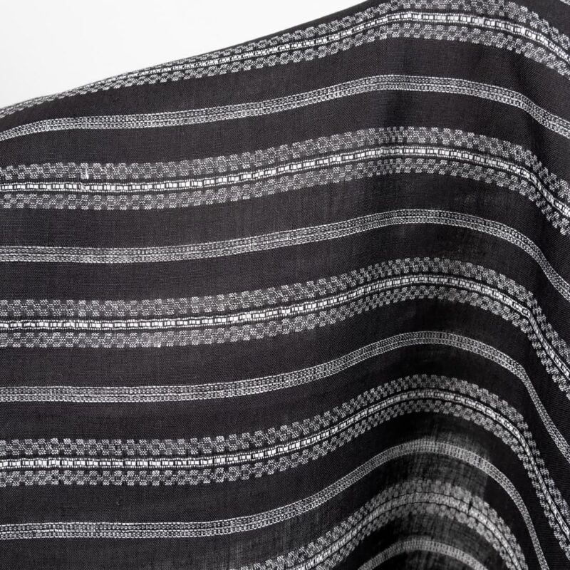 Linen fabric black with white patterned stripes close up detail