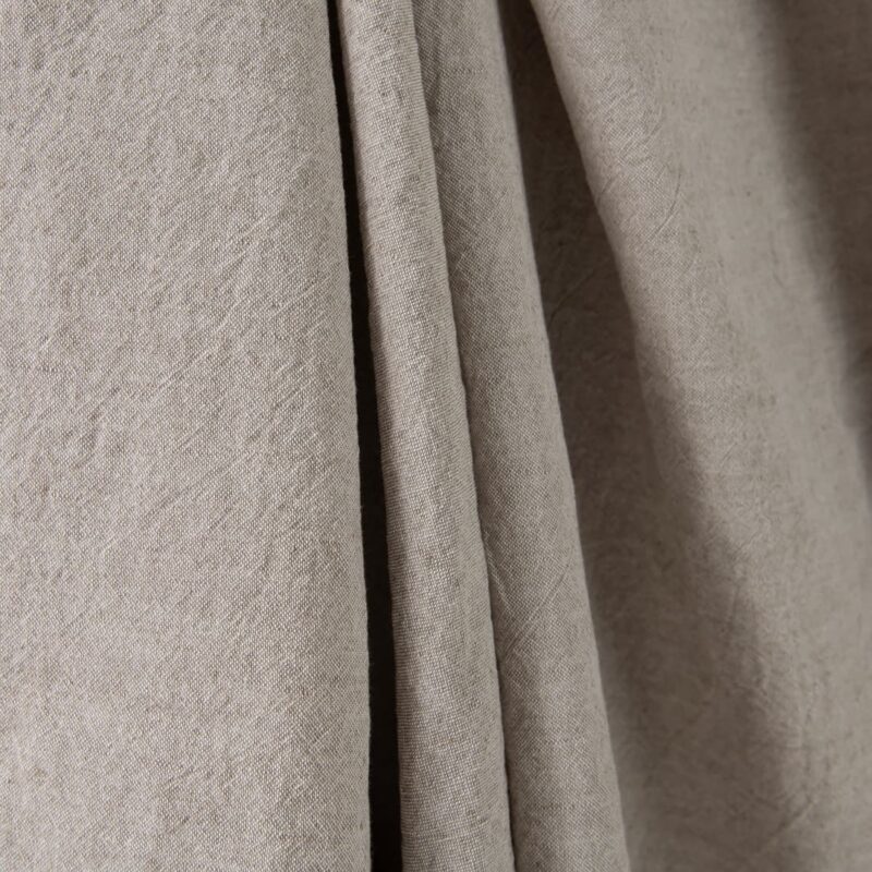 Wide washed linen cotton fabric sand colour close up detail
