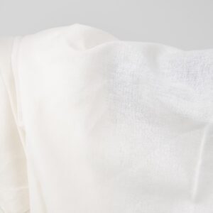 Wide linen cotton fabric white colour close up photo
