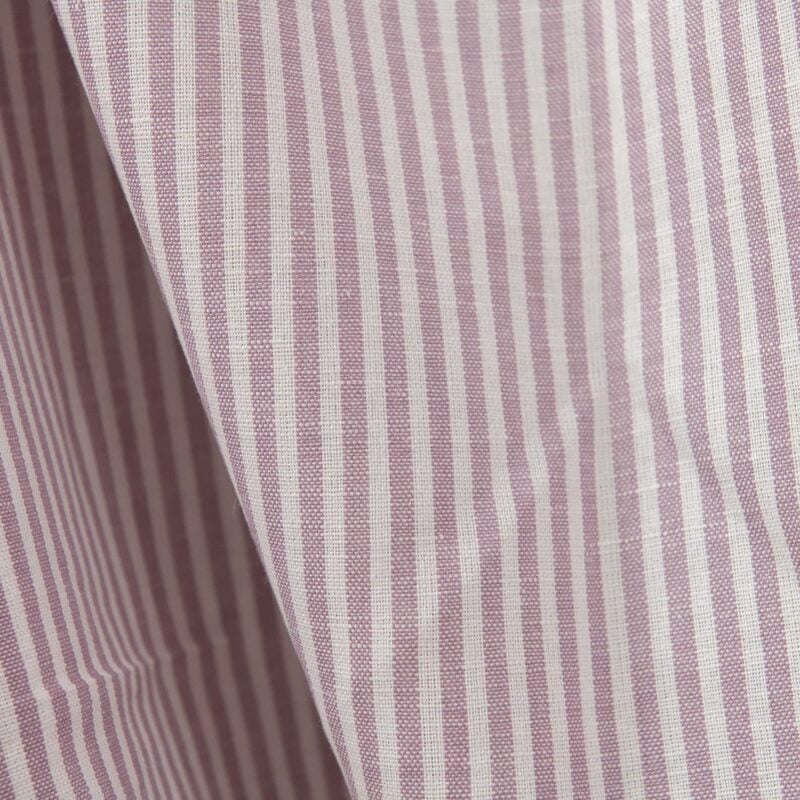 Wide linen cotton fabric in white and lilac stripes close up detail