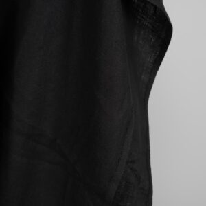 Black washed linen fabric in herringbone edge