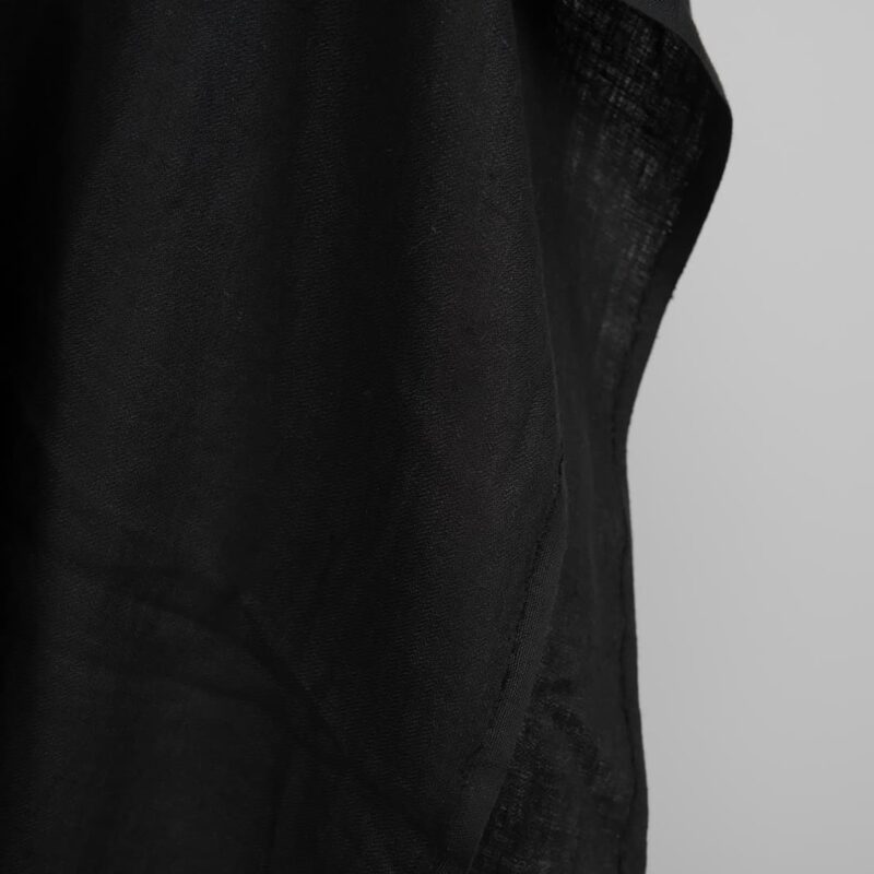Black washed linen fabric in herringbone edge