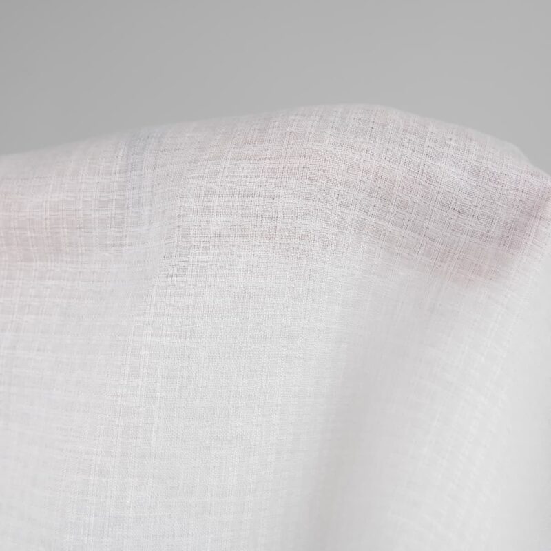 Linen fabric off-white colour patterned checks close up detail
