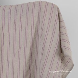 Natural color linen fabric in violet stripes, washed