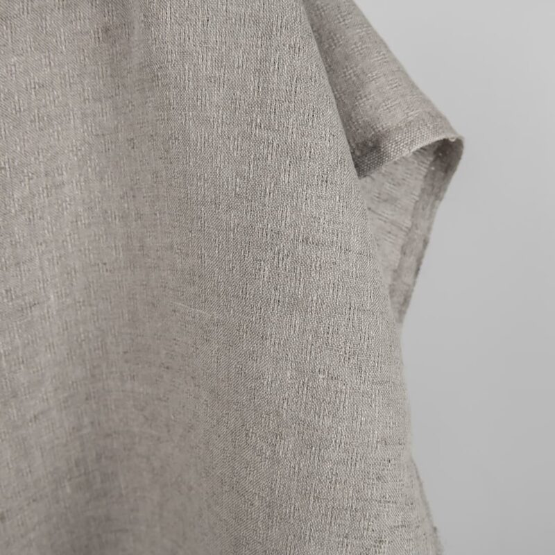 Natural linen fabric in an openwork pattern edge
