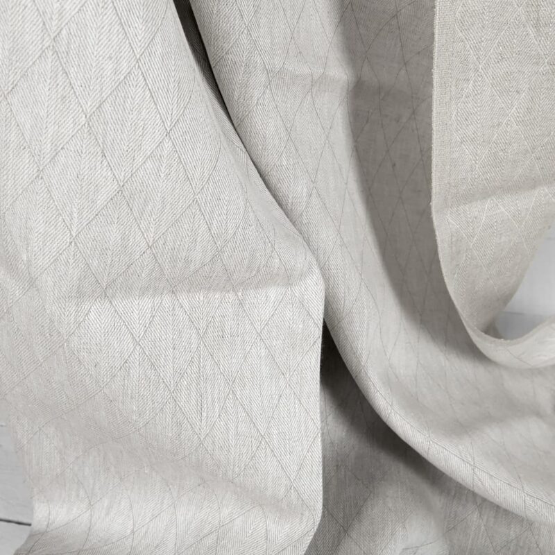 Beige double-sided linen fabric in a diamond pattern texture