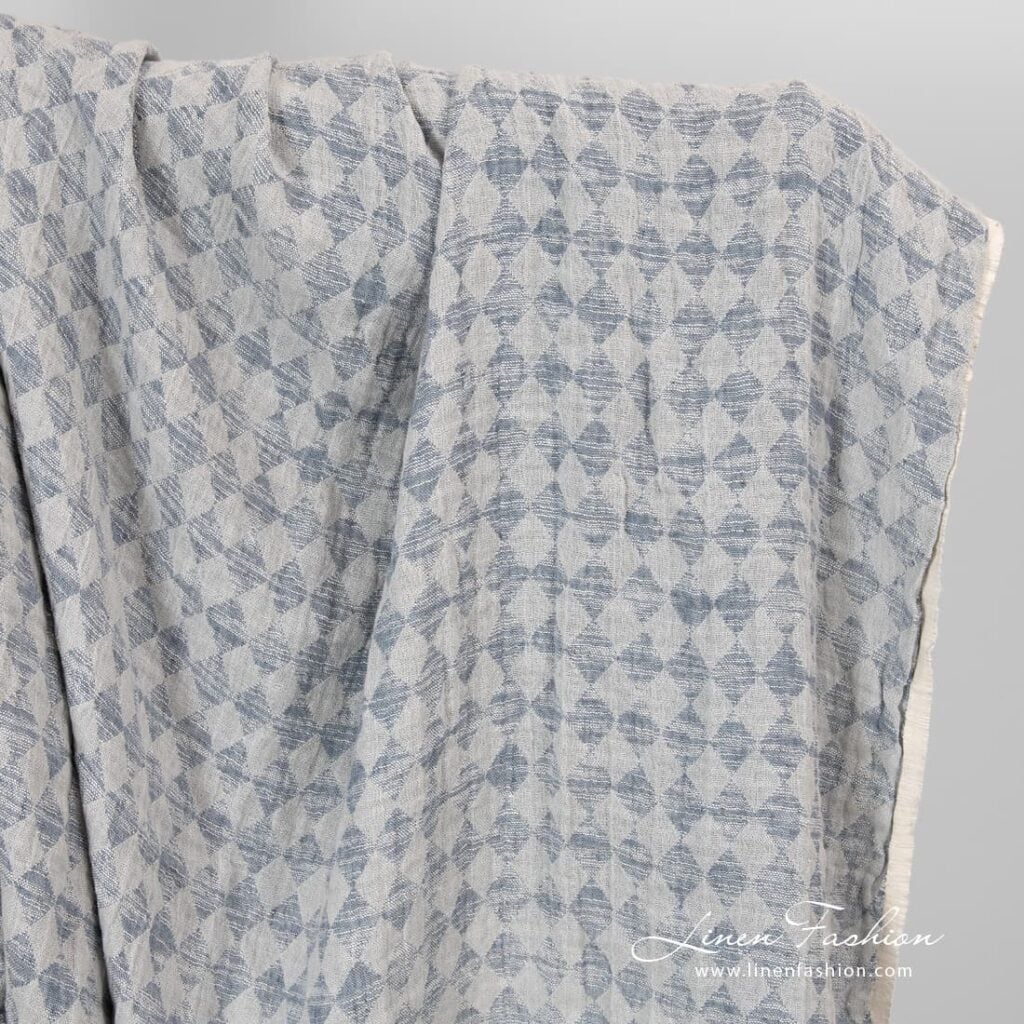 Linen cotton fabric in grey rhombus washed.