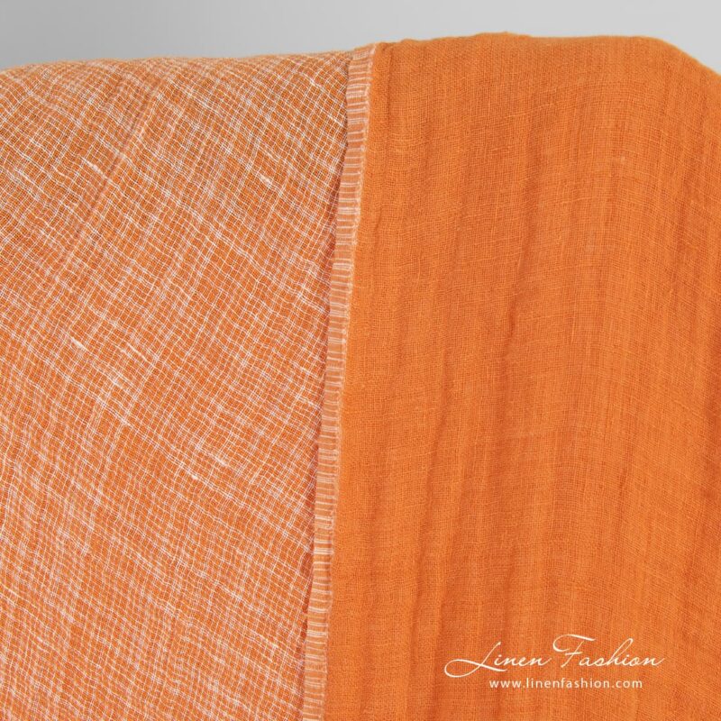 Double-sided orange linen fabric in checks, washed