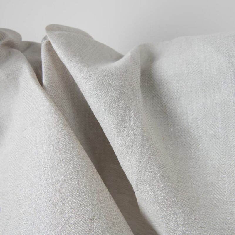 Linen fabric beige in herringbone pattern texture