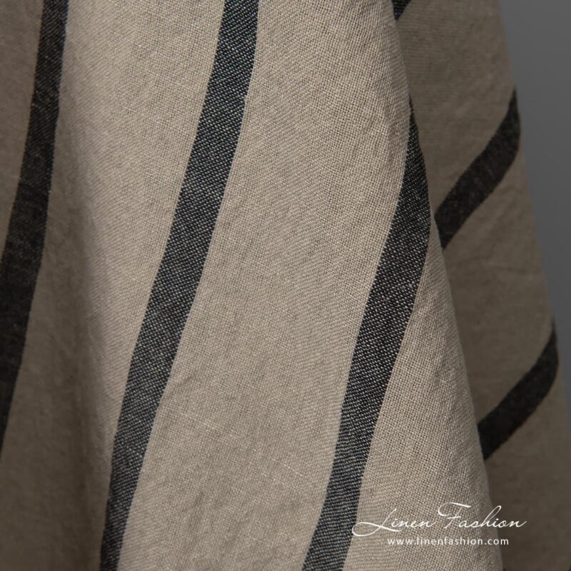Wide washed half linen fabric natural colour black stripes close up detail