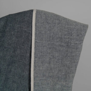 Washed linen wool fabric black white in herringbone pattern back side