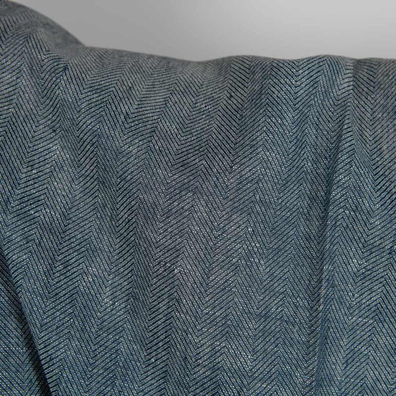 Linen wool fabric blueish-black and white herringbone close up detail