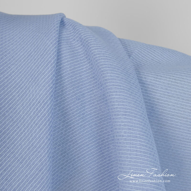 Linen cotton fabric light blue honeycomb close up detail