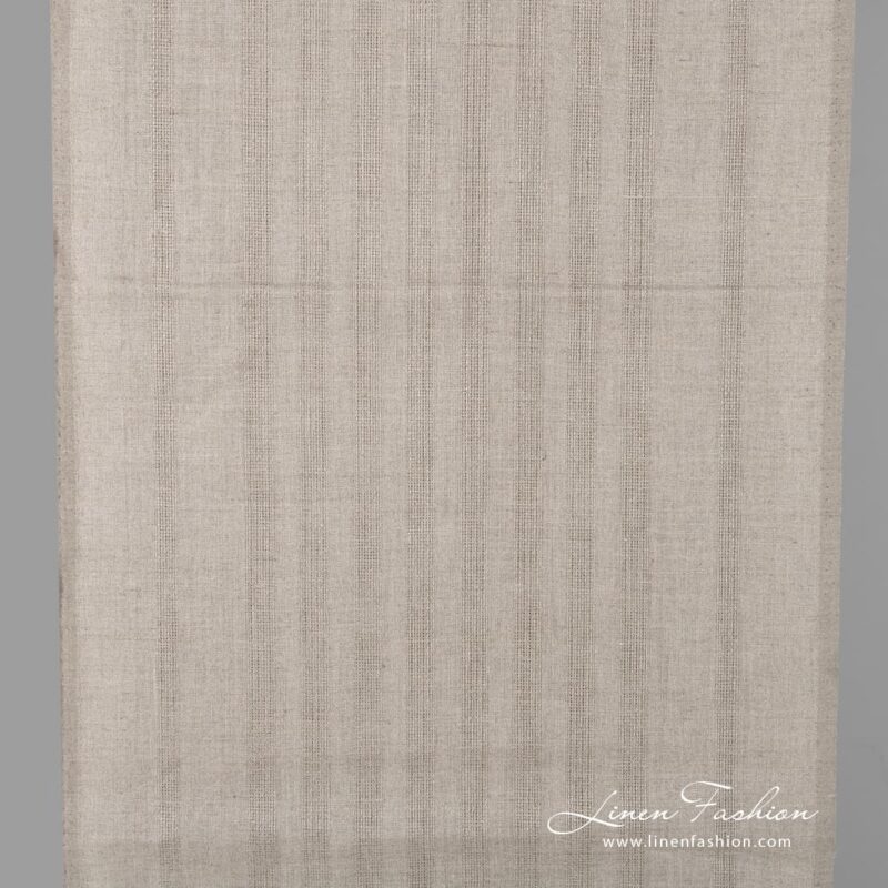 Linen fabric in natural flax colour with stripes.