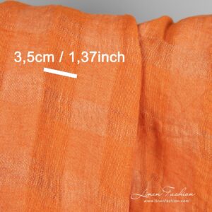 Linen fabric in transparent checks woven from orange and peach yarns