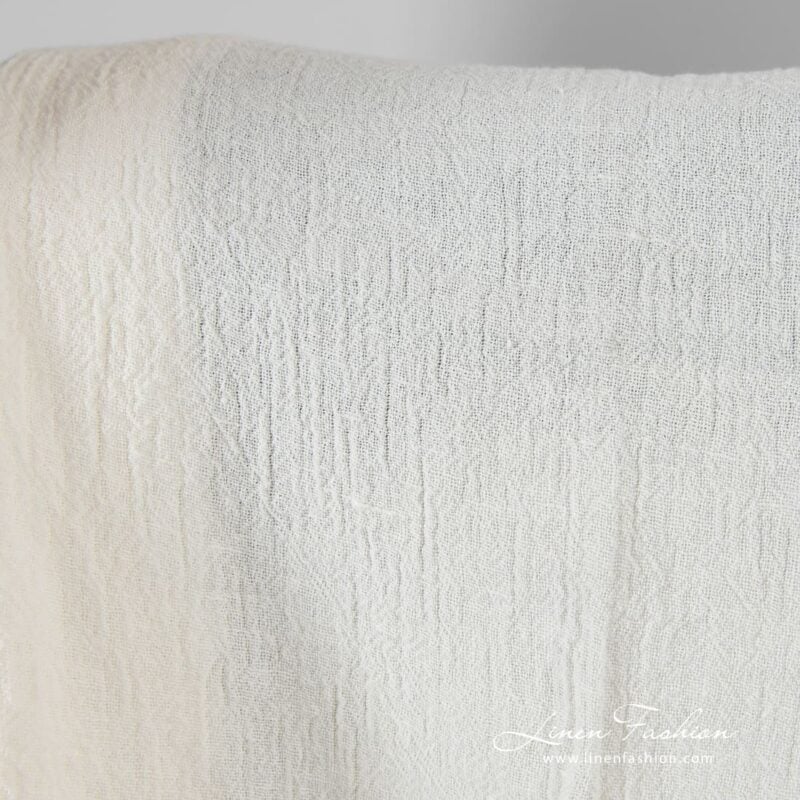 Linen fabric in off-white color, plain weave pattern