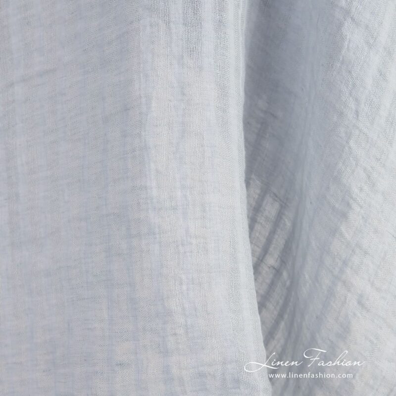 Blue linen fabric in vertical transparent stripes