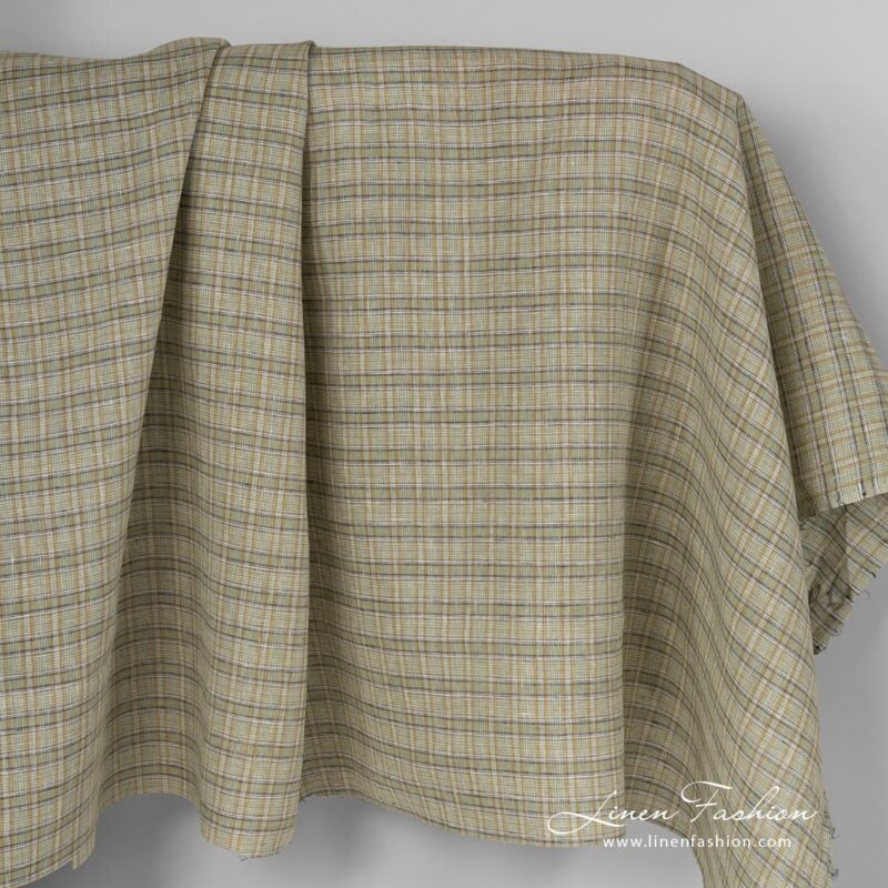 Checked linen fabric in green colour.