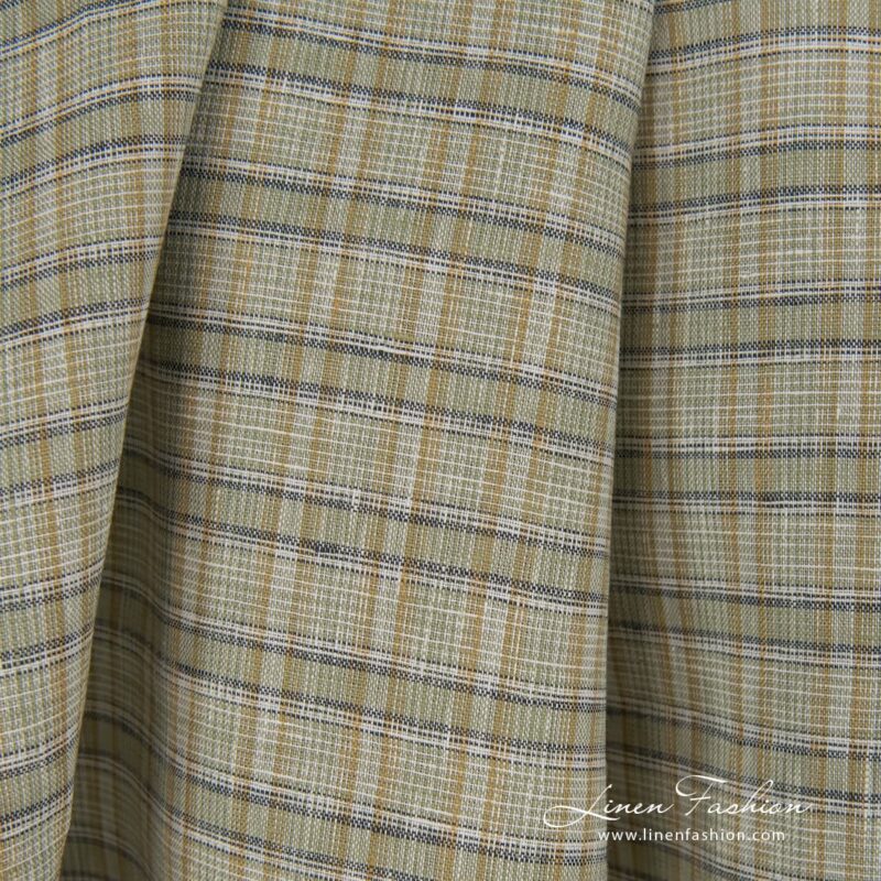 Green dyed 100% linen fabric in checks.