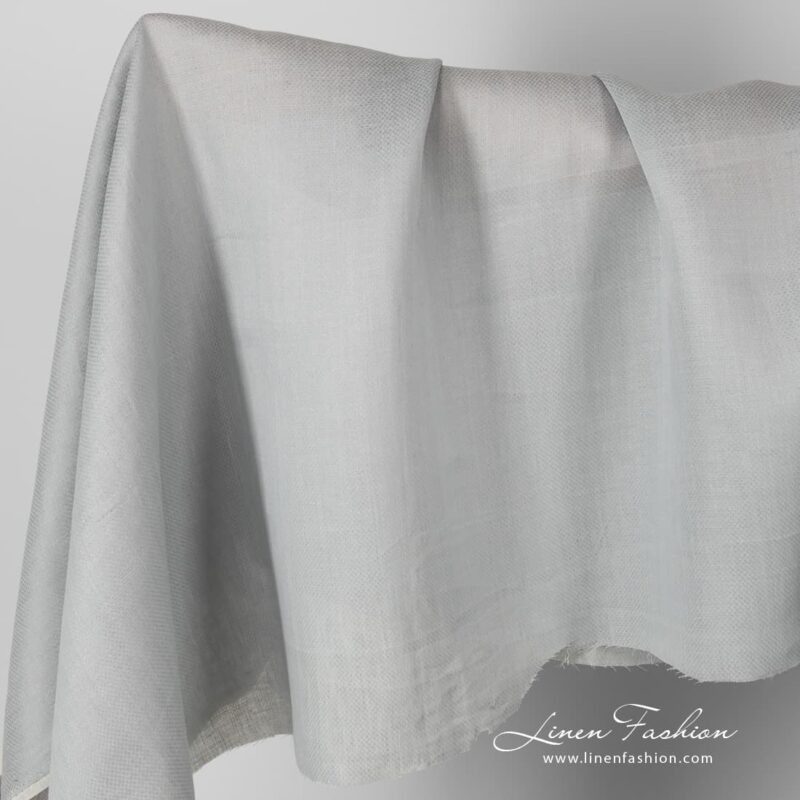 Patterned grey linen fabric.