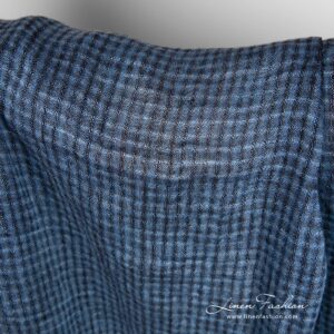 Linen fabric in transparent checks, woven from blue and black yarns
