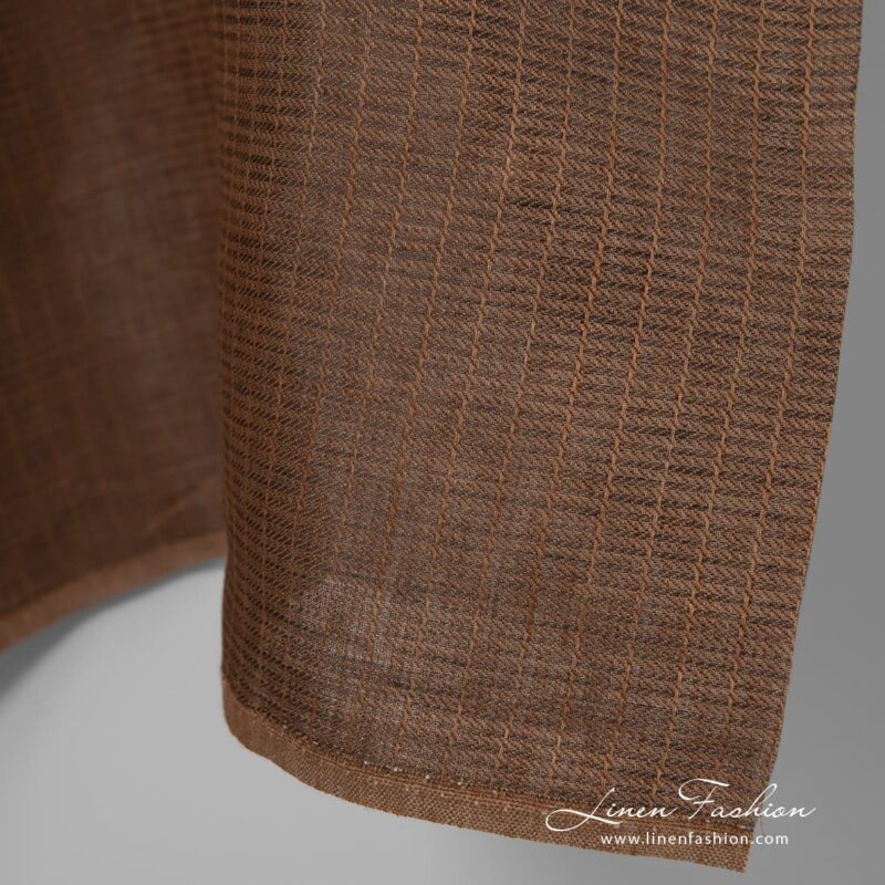 Herringbone patterned brown linen fabric.
