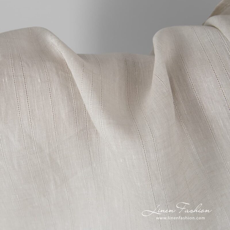 Sand coloured linen fabric with stripes.