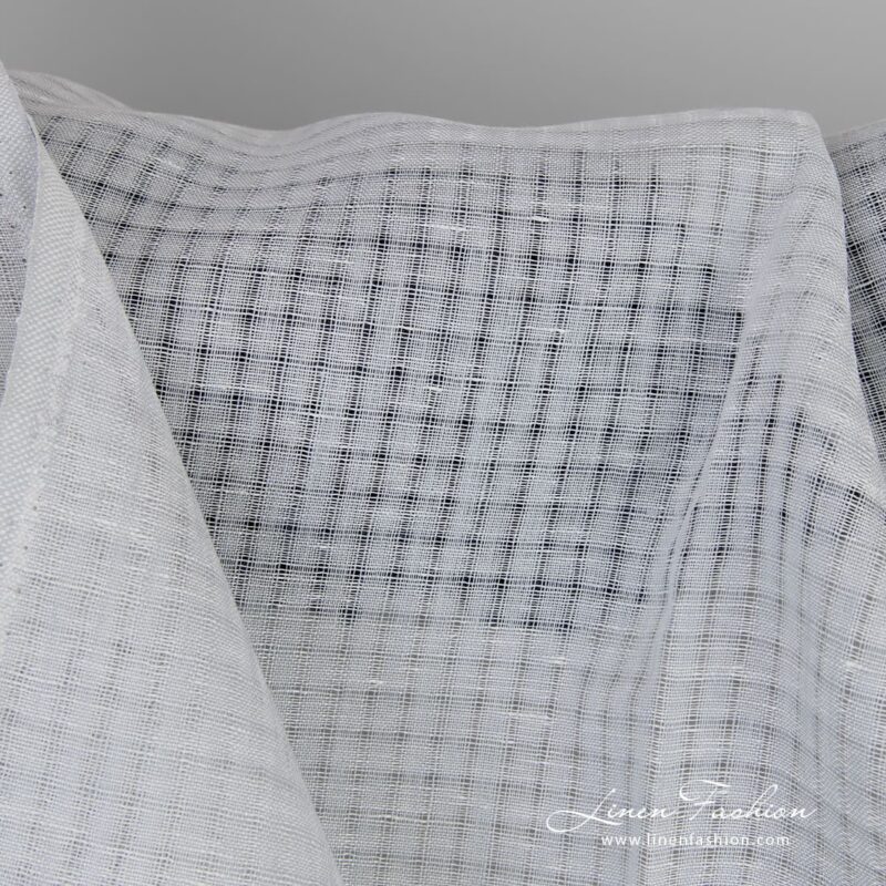 Linen fabric in transparent checks woven in bluish grey and white yarns