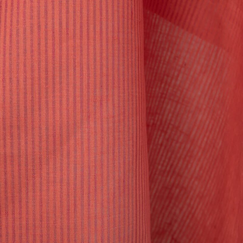 Linen fabric in coral and pink stripes close up detail