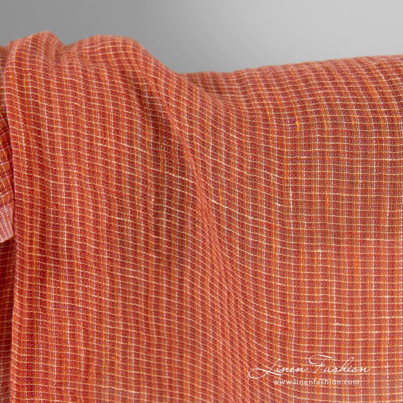 Transparent linen fabric in orange melange, specially washed