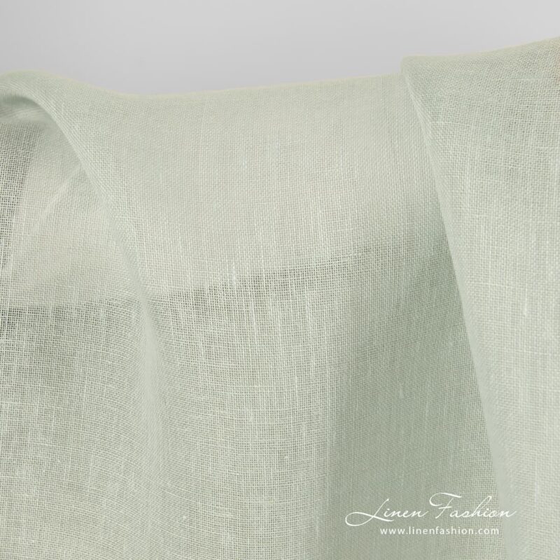 Pale green dyed 100% linen fabric.