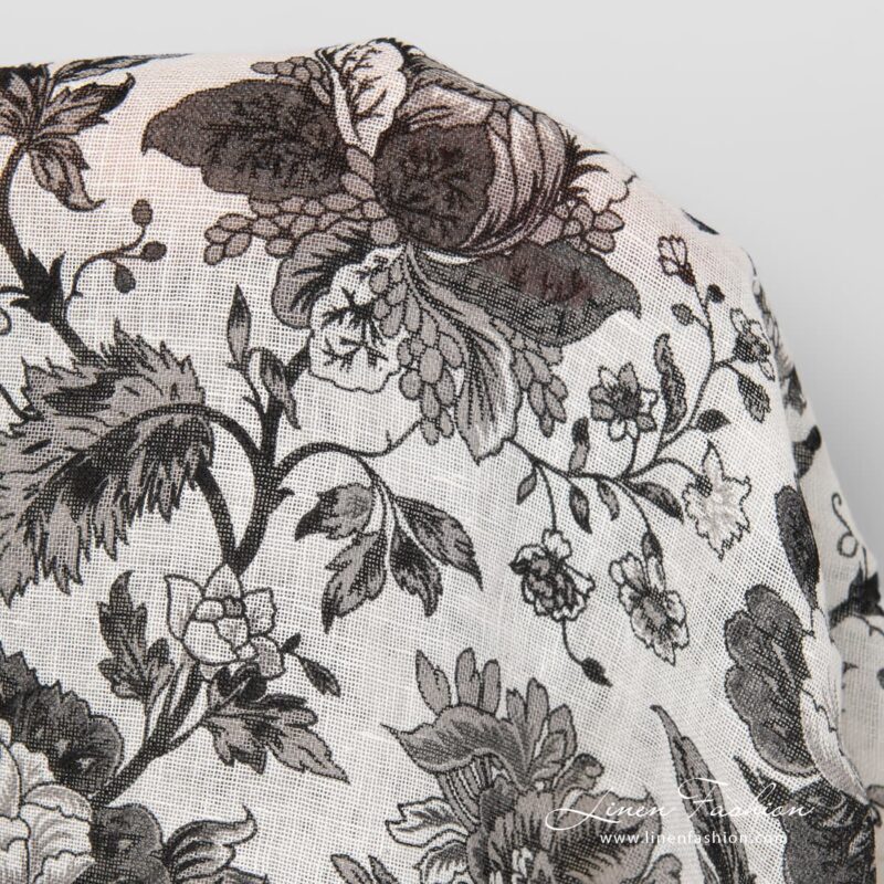 Linen fabric with black printed flowers.