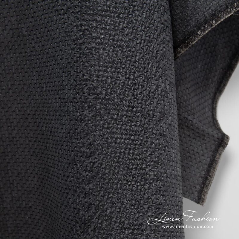 Patterned 100% linen fabric in black.