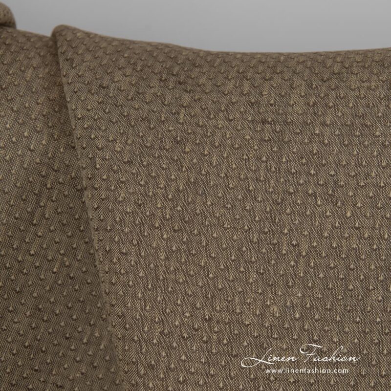Brown dyed linen fabric with spots.