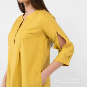Linen mustard dress with open sleeves.
