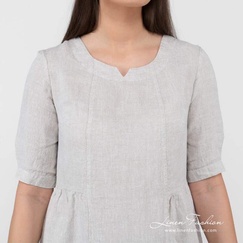 beige long linen dress with 3/4 sleeves.