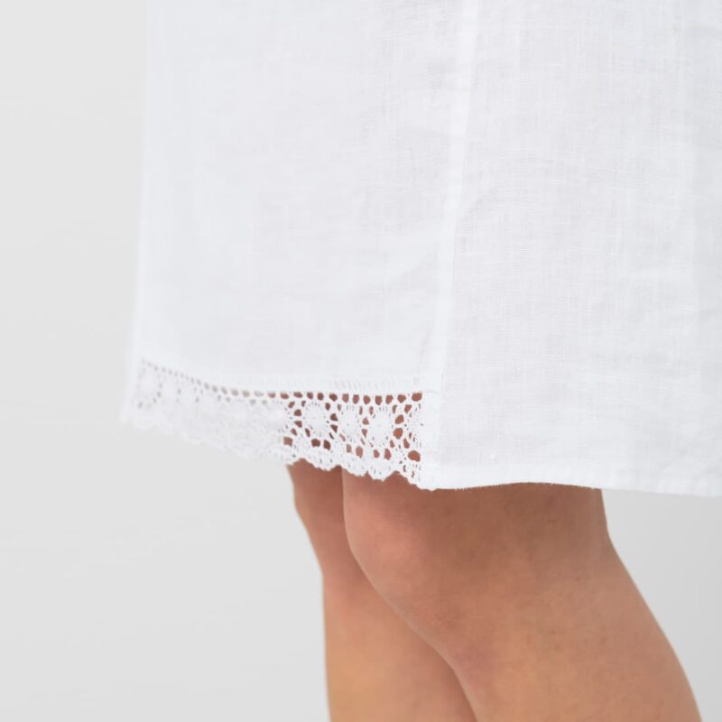 White knee length linen dress, lace detail on front bottom